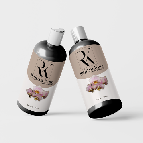 Two bottles of Rejuva Kare Natural Shampoo and Natural Conditioner with floral designs on the labels leaning toward one another.