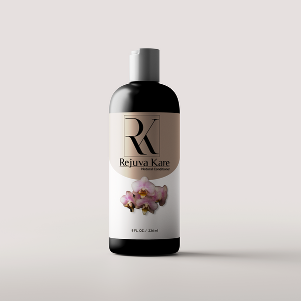 A bottle of Rejuva Kare Natural Conditioner with a label featuring a pink flower.