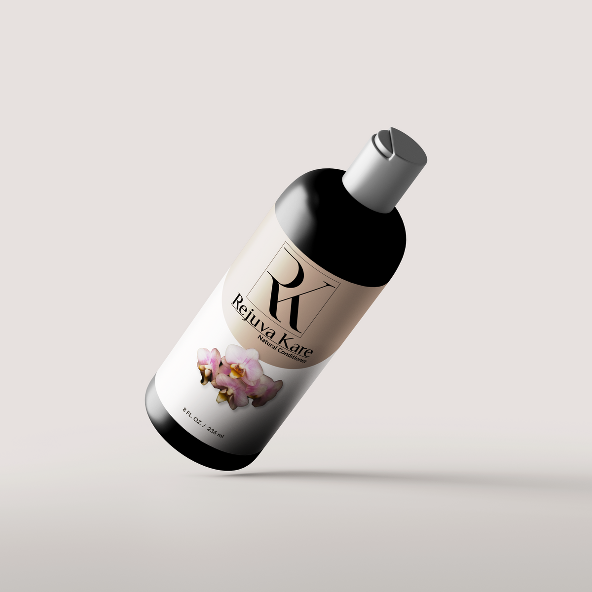 An 8oz bottle of Rejuva Kare Natural Conditioner with a label featuring a pink flower tilted diagonally cating a shadow on a white background.